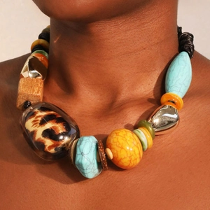 Ethnic bohemian necklace featuring turquoise stones and leopard print resin beads