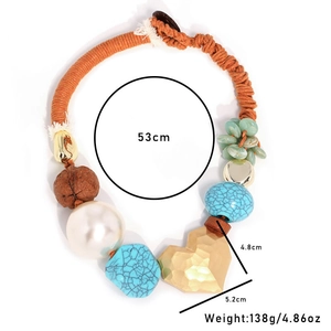 Bohemian woven rope necklace with turquoise, pearls, and a large golden heart pendant