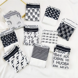 Men's ice silk boxer briefs with diverse black and white patterns and elastic waist