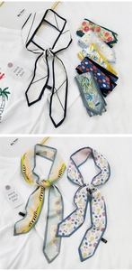 Vue détaillée de divers motifs sur de longs foulards fins en soie aux pointes effilées