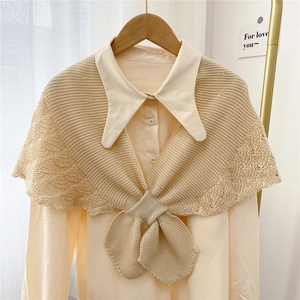 Beige knitted shawl for women featuring hollow out crochet and ribbed edges over a shirt