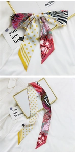 Détail d'un foulard en soie française avec motifs de cœur et impression double face