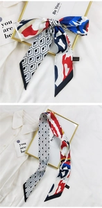 Détail d'un foulard twilly style français avec motifs losanges et nœud papillon élégant