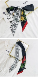 Détail d'un foulard en soie de style français avec motifs floraux et éléphants bohèmes