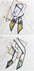 Détail d'un foulard en soie fin avec bordure noire et imprimé artistique coloré