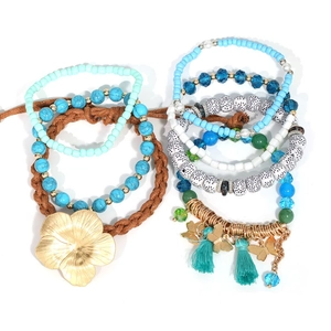 7-piece Bohemian stackable bracelet set with sea blue charms, floral tassels and butterfly