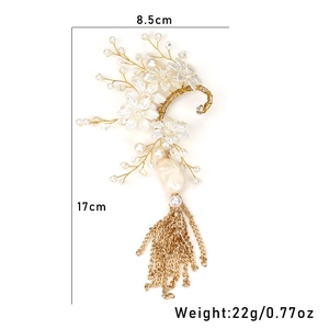 Detail of floral bridal ear wrap with pearls, crystals, and long golden chain tassels