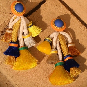 Bohemian oversized tassel earrings with colorful fringe and woven cord on stone