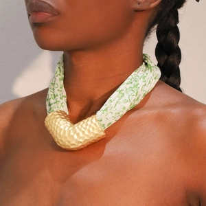 V-shaped hammered gold pendant necklace with green heart print silk scarf band on model