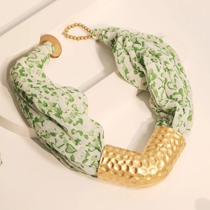 Detail of bohemian chiffon heart print scarf necklace with gold hammered metal tube