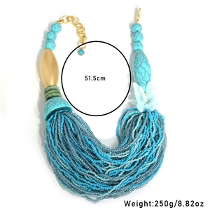 Detailed close-up of Bohemian multi-layered turquoise beads with golden lobster clasp