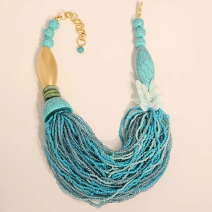Bohemian multi-layered beaded necklace with turquoise fringe and golden accents