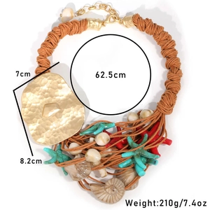 Detail of nautical woven necklace showing shells and golden hammered metal plate