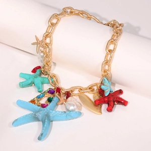 Golden sea star charm necklace with colorful gemstones and a baroque pearl pendant