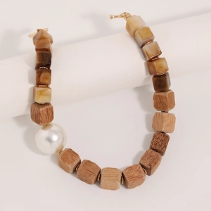 Handmade beaded necklace with square wood beads, amber resin, and large white pearl focal