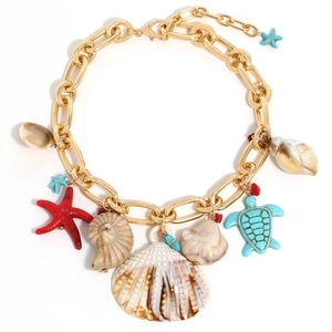 Golden chunky chain necklace with colorful starfish, turtle, and shell charms for beach