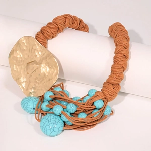 Bohemian woven rope necklace with irregular gold metal pendant and turquoise beads