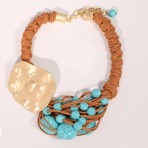 Bohemian woven rope necklace with irregular gold hammered pendant and turquoise beads