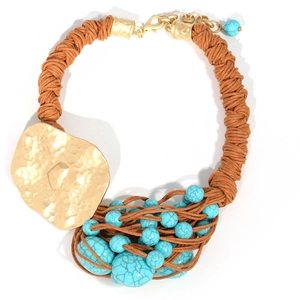Handwoven necklace featuring a hammered gold pendant and turquoise beads on brown cord
