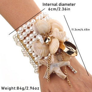 Detailed view of multilayer pearl bracelet with starfish charms and dimension measurements