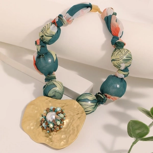 Bohemian large pendant necklace featuring fabric floral rope and faux pearl metal medallion