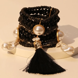 Chic multi-layer black beaded bracelet with gold faux pearls and a long tassel pendant