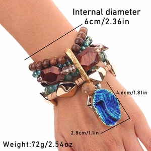 Detail of bohemian multilayer beaded bracelet with large blue teardrop pendant and specs