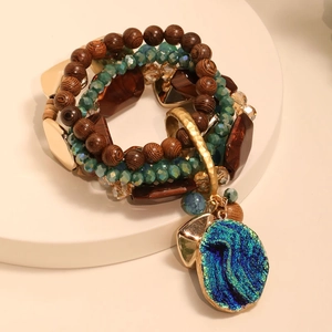 Bohemian multi-layer beaded bracelet set featuring a teal crystal druzy pendant