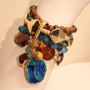 Bohemian multi-layer handmade beaded bracelet with blue stone pendant and golden accents