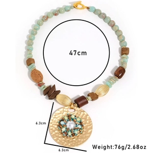 Bohemian beaded wood necklace with large gold hammered disc pendant and faux pearl