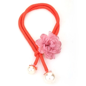 Pink mesh flower necklace with red cord and faux pearl accents on a white background