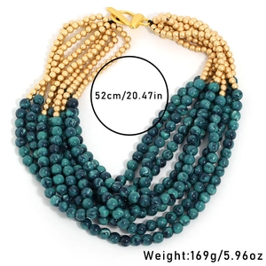 Detail view of multi-layer beaded necklace with green marble beads and toggle clasp size