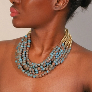Handmade multi-layered beaded necklace with blue marble stones and gold accents