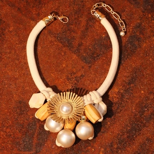 Elegant sunburst sunflower necklace with large pearls and thick cream braided rope chain