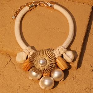 Elegant woven rope necklace with faux pearl sunflower pendant in bohemian style
