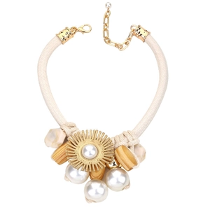 Elegant woven rope necklace with sunflower pearl pendant and ethnic accents on white background
