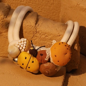 Artisan handmade insect and mushroom necklace with braided cotton ropes and ladybug charm