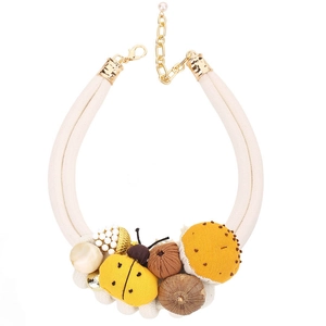 Handmade woven necklace featuring yellow ladybug, acorn and mushroom fabric pendants