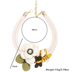 Detailed view of bohemian floral necklace with 58cm circumference and dragonfly charm