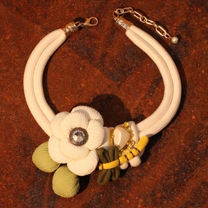 Handmade fabric butterfly flower necklace with white camellia on vintage metal background