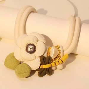 Floral butterfly hair scrunchie with cream camellia flower and dragonfly ornament