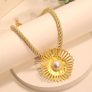 Vintage gold sunflower necklace with large pearl center on chunky braided chain