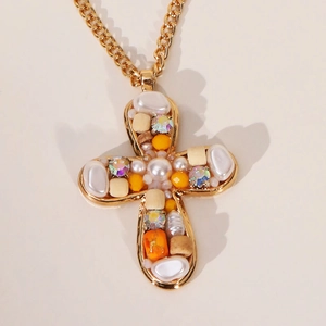 Gold cross pendant necklace with pearls and rhinestones on a thick chain link