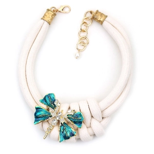 Chunky cream rope necklace with dragonfly pendant featuring teal enamel and rhinestones