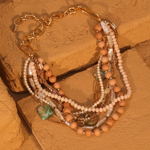 Bohemian multi-layer necklace with wooden beads, faux pearls, and turquoise marble charm