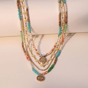 Layered bohemian daisy necklace with colorful crystal beads and butterfly charms