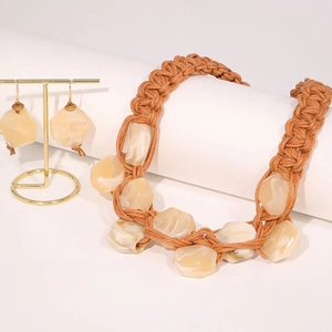 Detail view of handmade braided rope necklace set with resin stone pendants