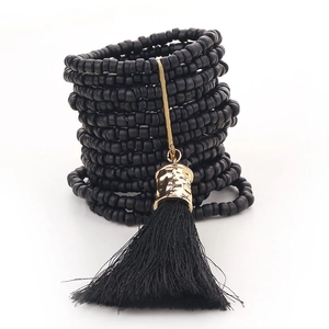 Bohemian multi-layer handmade beaded bracelet with black tassel and gold metal cap accent