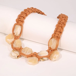 Bohemian handmade thick rope necklace with irregular resin beads on white stand