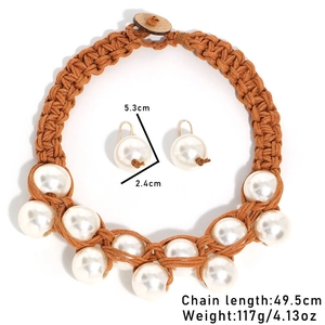 Detail view of handmade braided rope necklace and earrings with large faux pearls and dimensions